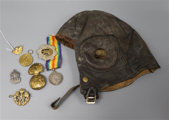 A military flying helmet, a 9ct gold and enamel Australian Commonwealth Military Forces brooch, WWI medals etc.